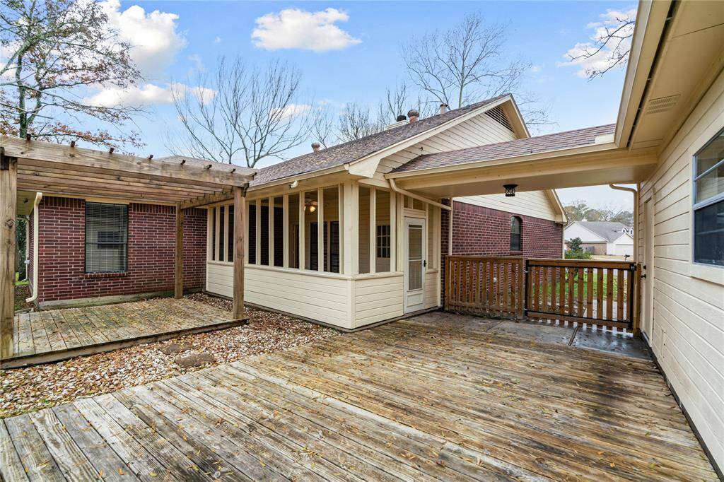 Back yard: Deck showcasing the pergola and the sunroom
