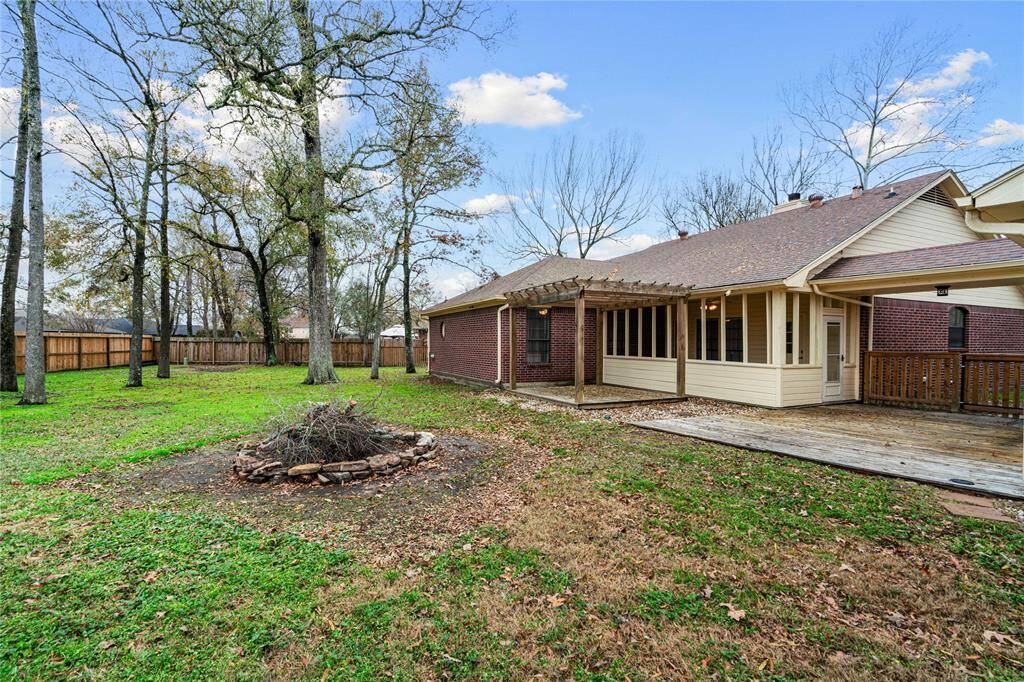 The back yard is two lots combined of almost 1/2 an acre. Plenty of space for swimming pool, extension of the the deck for entertaining.