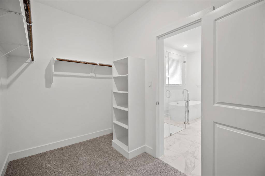 Large walk-in closet in primary suite
