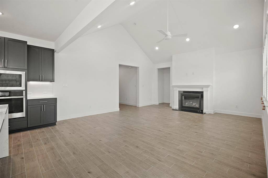 Spacious great room with vaulted ceilings and cozy fireplace (*Photo not of actual home and used for illustration purposes only.)