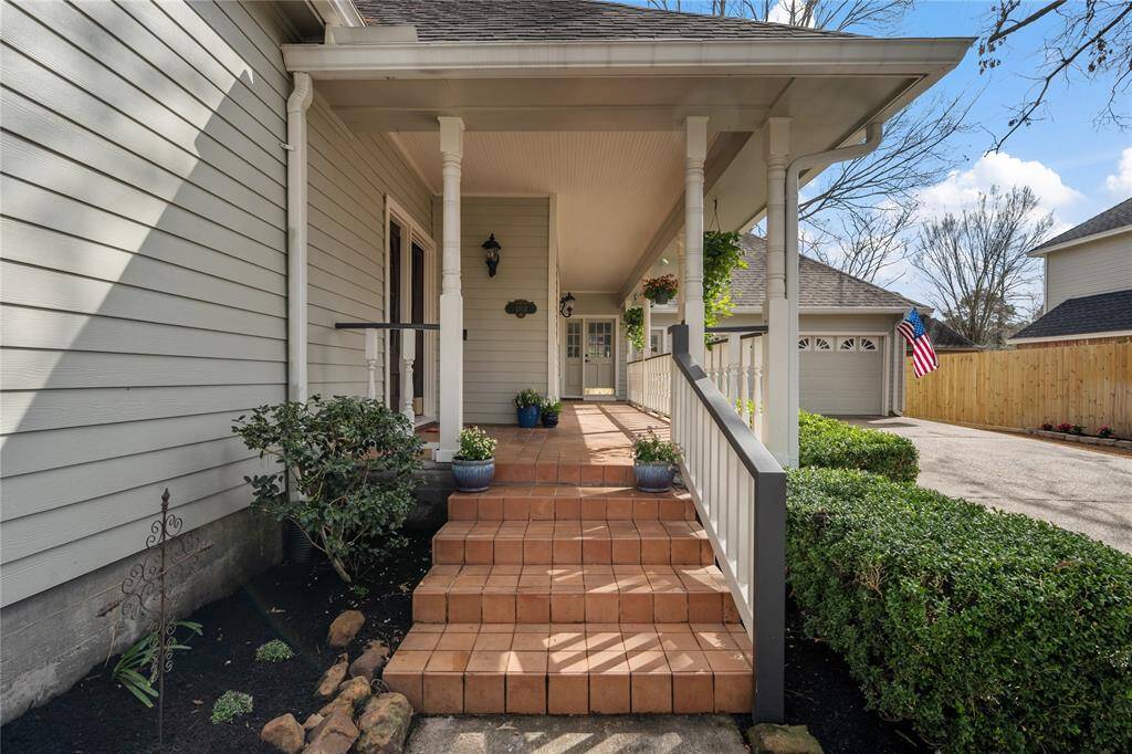Front entry steps to the wonderful porch... steps away from the cul-de-sac, greenbelt, and pond to fish in!