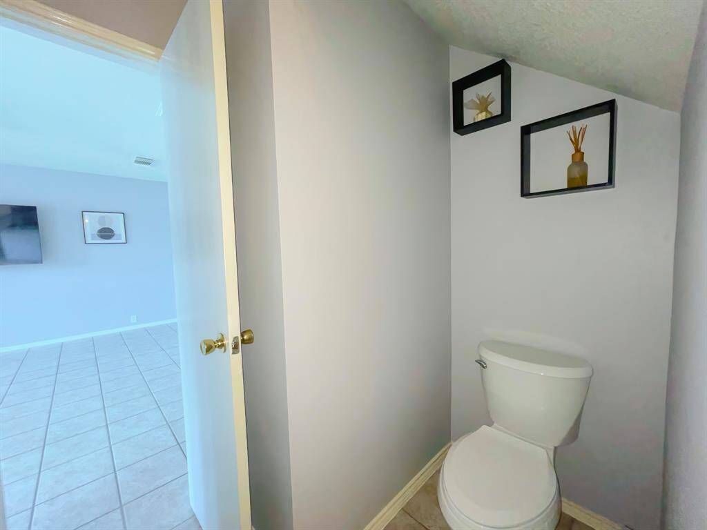 Half bath with new toilet and new counters and faucets