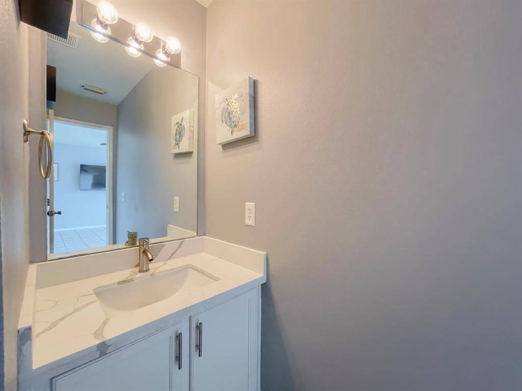 Half bath with new toilet and new counters and faucets
