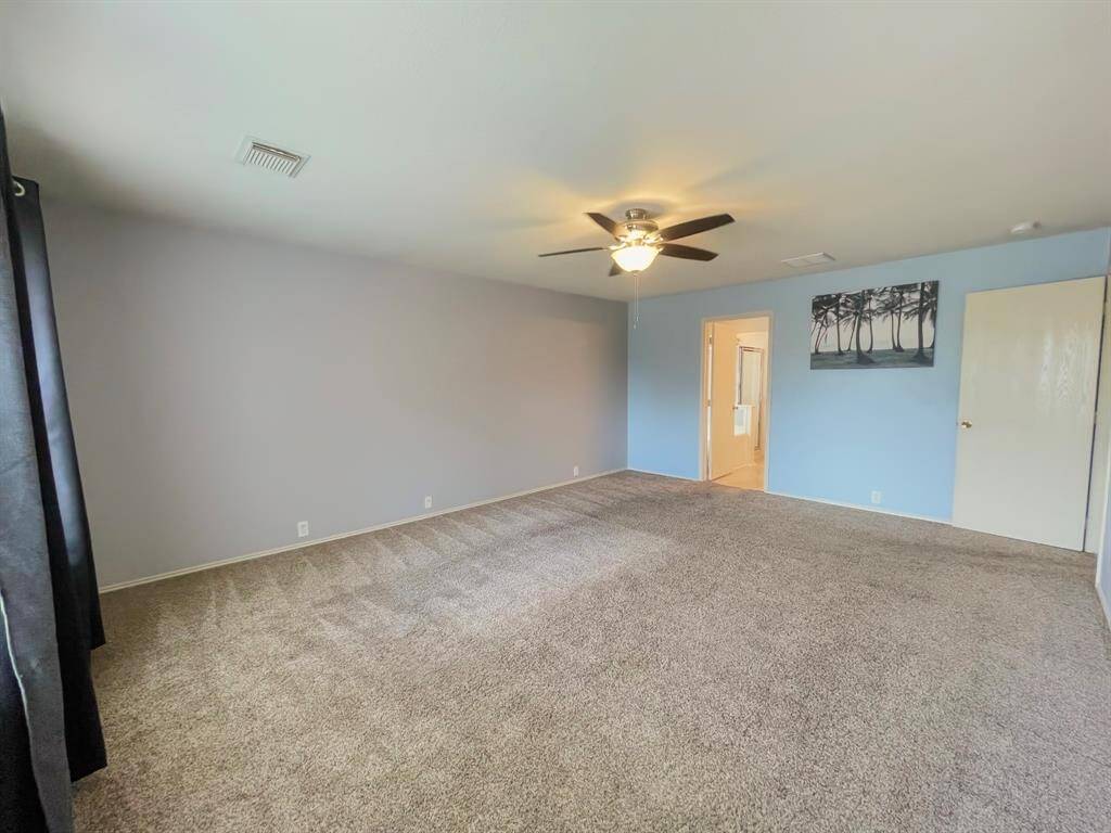 Huge primary bedroom with private primary bath and walk-in closets