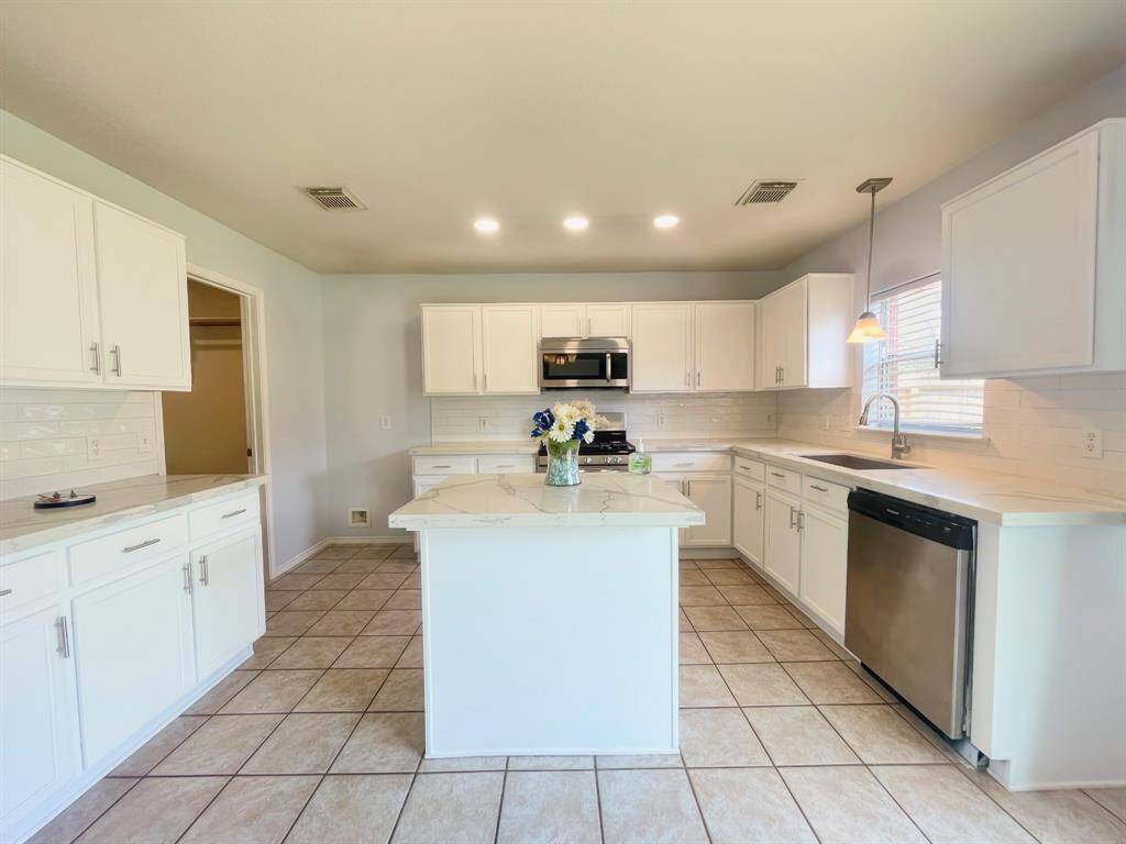 Remodeled kitchen with custom quartz counters