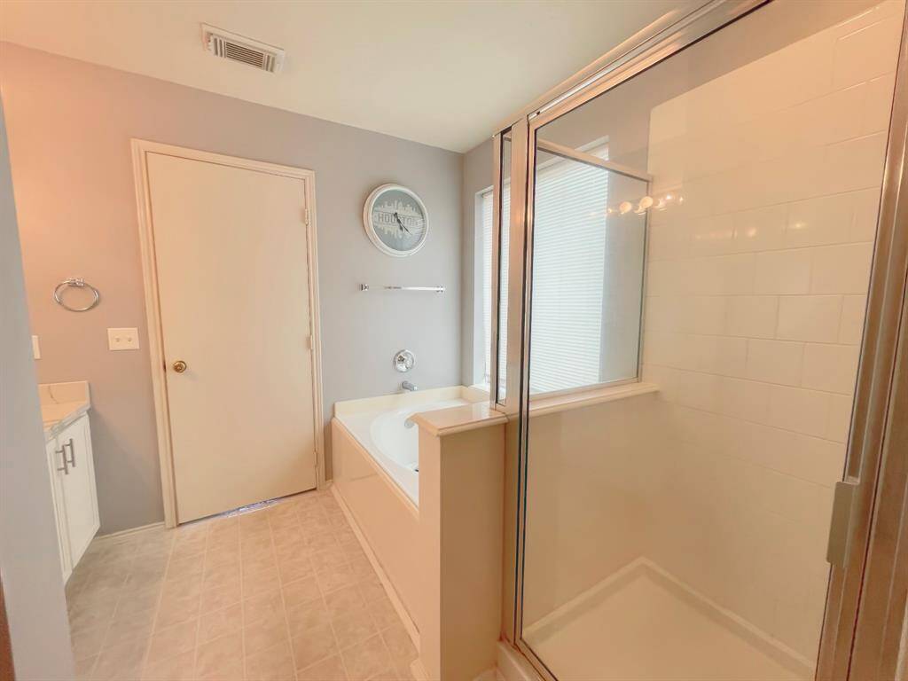 Primary bath with Standing shower and soaking tub
