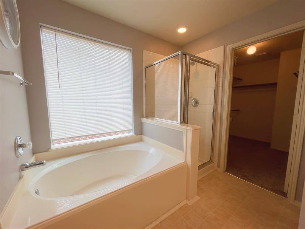 Primary bath with Standing shower and soaking tub