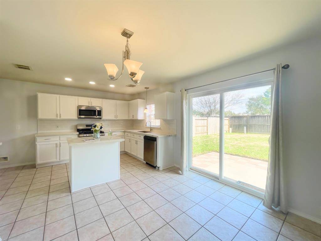 Kitchen open to breakfast room with tons of natural light