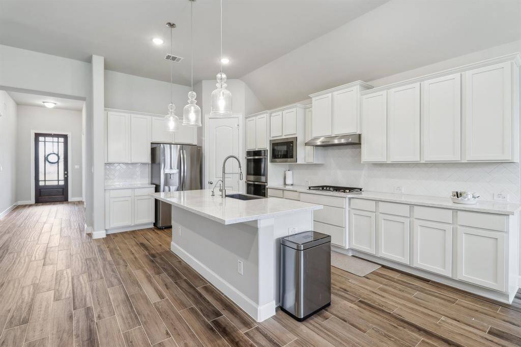 Beautiful kitchen with a breakfast bar to enjoy company
