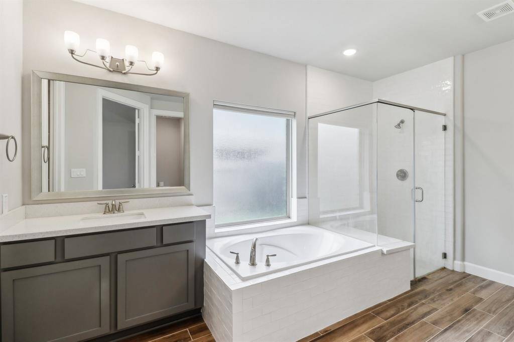 Huge soaking tub with separate standing shower