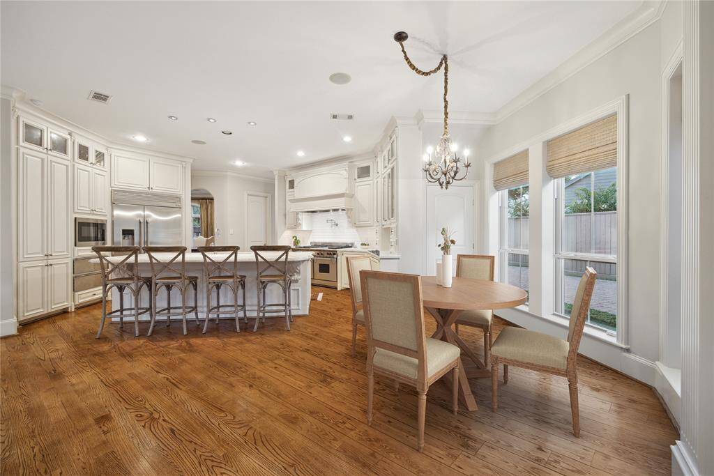 Breakfast room is between the kitchen and family room.  Second walk-in pantry behind the closed door would make a perfect wine grotto.