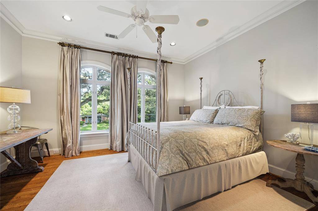 Upstairs, here is one of five generously sized secondary ensuite bedrooms.  This one, overlooking the front yard, has two walk-in closets.