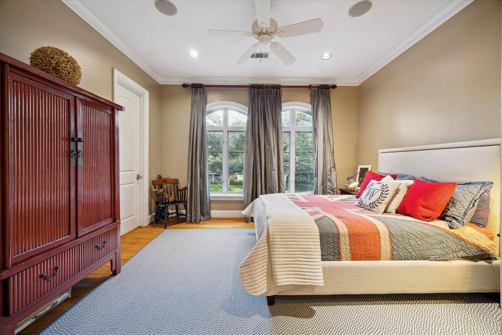 This secondary bedroom, also overlooking the front yard, also has two closets and is amply sized.