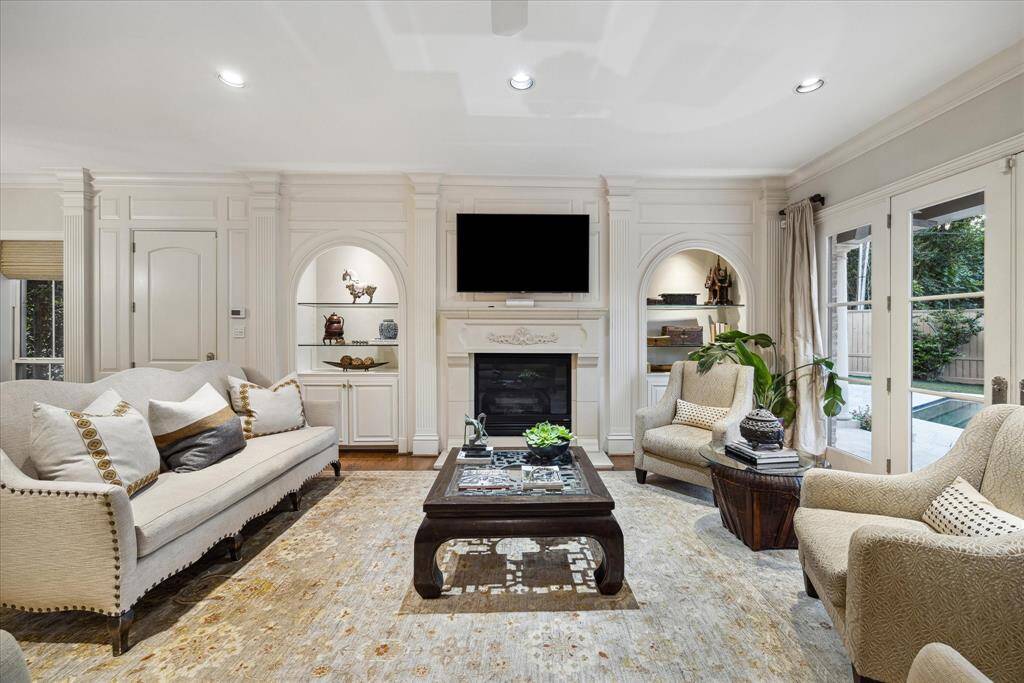 Here's another view of the living area, with its cast stone fireplace flanked by illuminated bookcases.