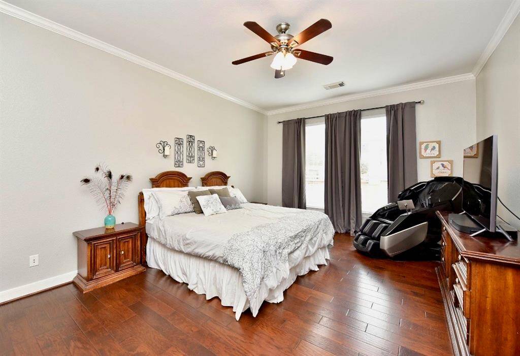 The owner's suite features hardwood floors, high ceilings, and ensuite spa quality primary bath.