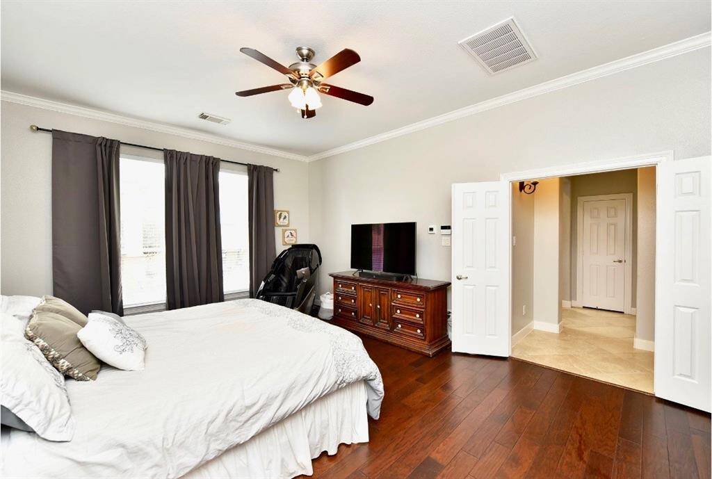 The owner's suite features hardwood floors, high ceilings, and ensuite spa quality primary bath.