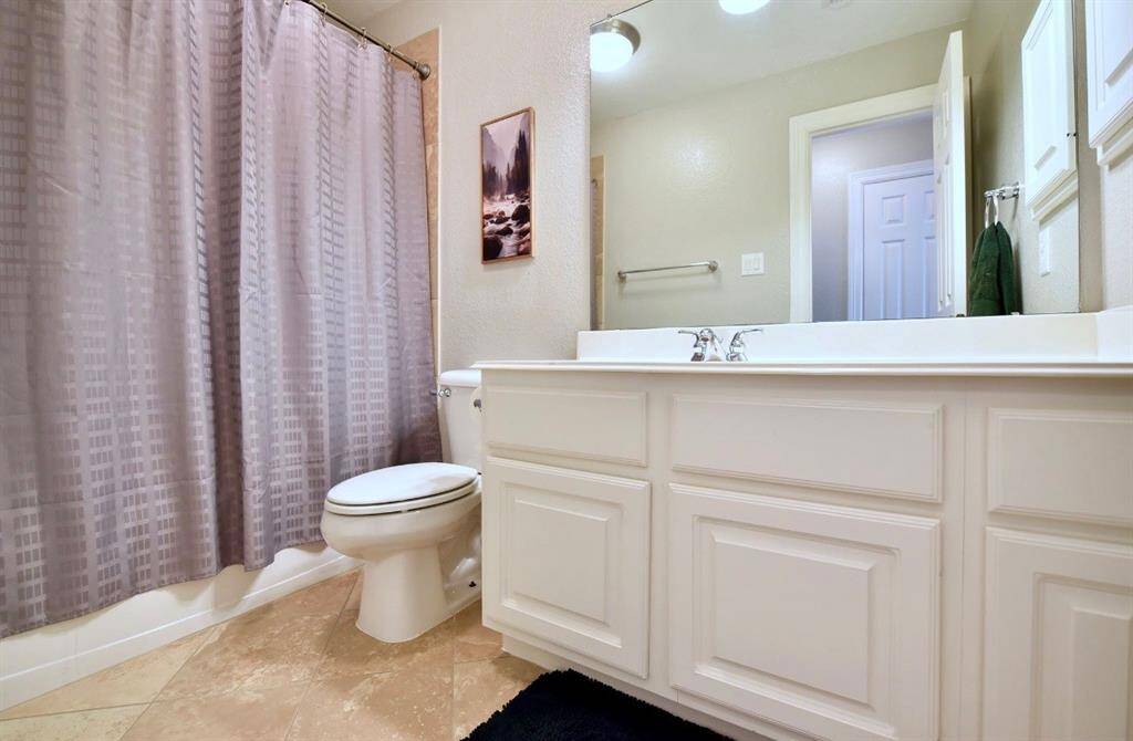 The secondary bathrooms are ideally located off of the secondary bedrooms and  ahve large vanities and shower/tub combos.