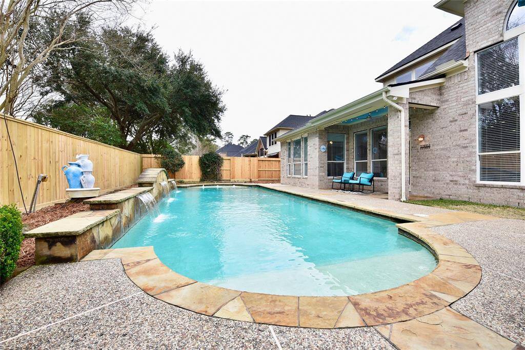 This backyard retreat is feature rich with a covered patio, covered outdor kitchen and inviting pool with sunshelves perfect for hosting guests and creating poolside magic moments with the family.