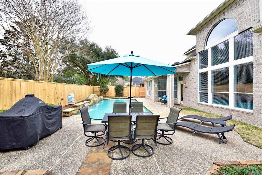 This backyard retreat is feature rich with a covered patio, covered outdor kitchen and inviting pool with sunshelves perfect for hosting guests and creating poolside magic moments with the family.