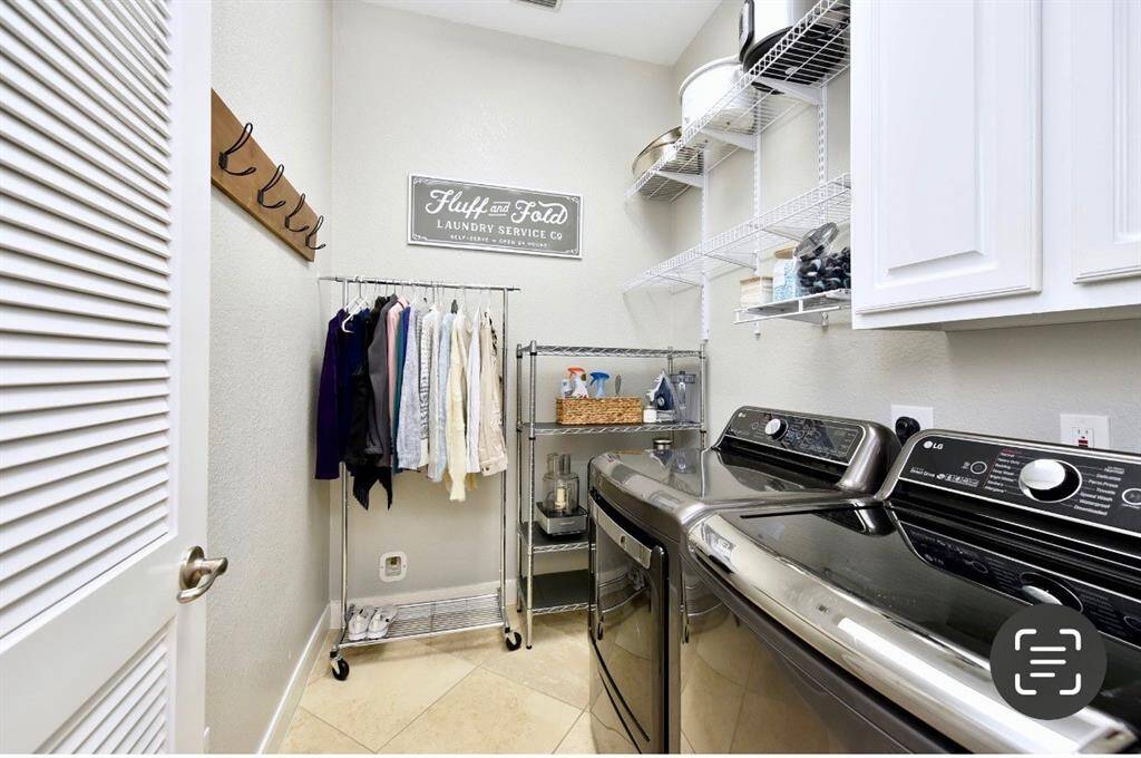 The utiility room accommodates full size washers and dryers and is spacious enough for a second refrigerator or additional storage.