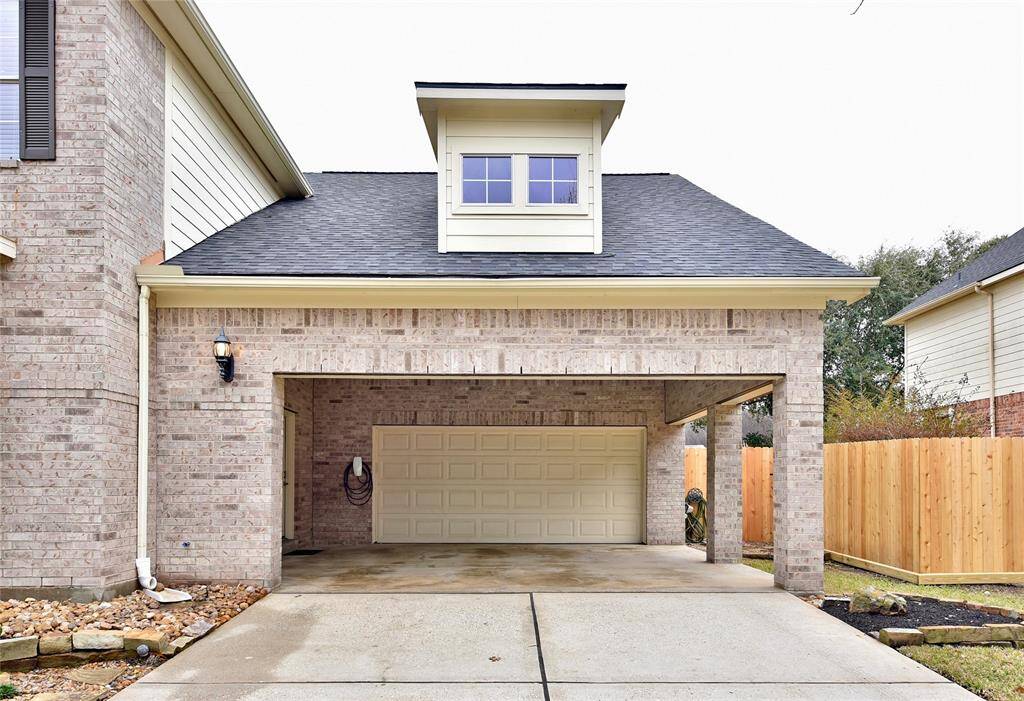 The two car garage and covered parking and porte cochere is complete with a Tesla wall charger perfect for Tesla and EV enthusiasts or hobbists.