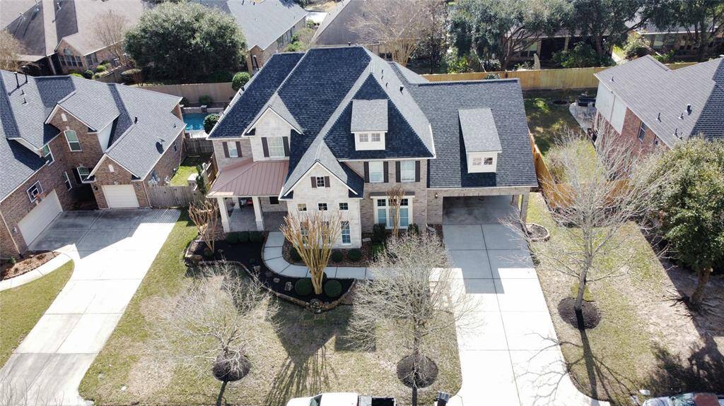 Welcome to 6002 Shady Birch Hollow in the coveted neighborhood of Kings Point Village!