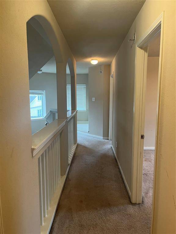 Hallway upstairs to the 3 bedrooms
