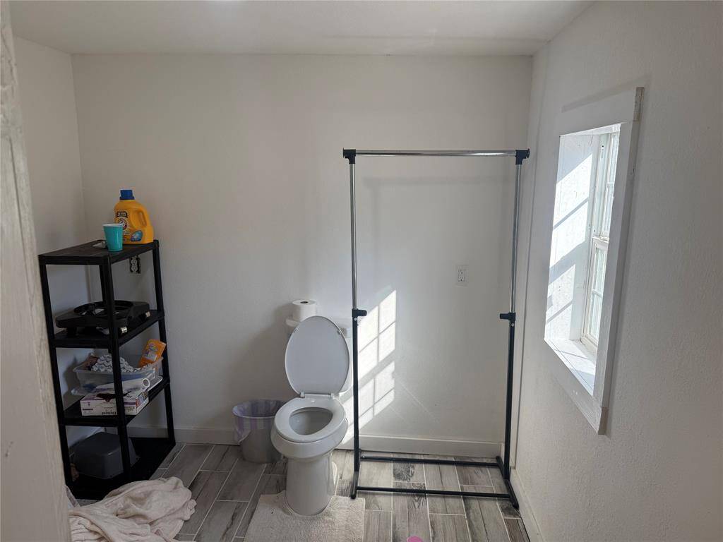 Utility room with half bathroom
