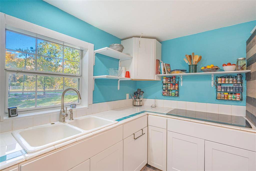 kitchen with window which looks out to the front of property