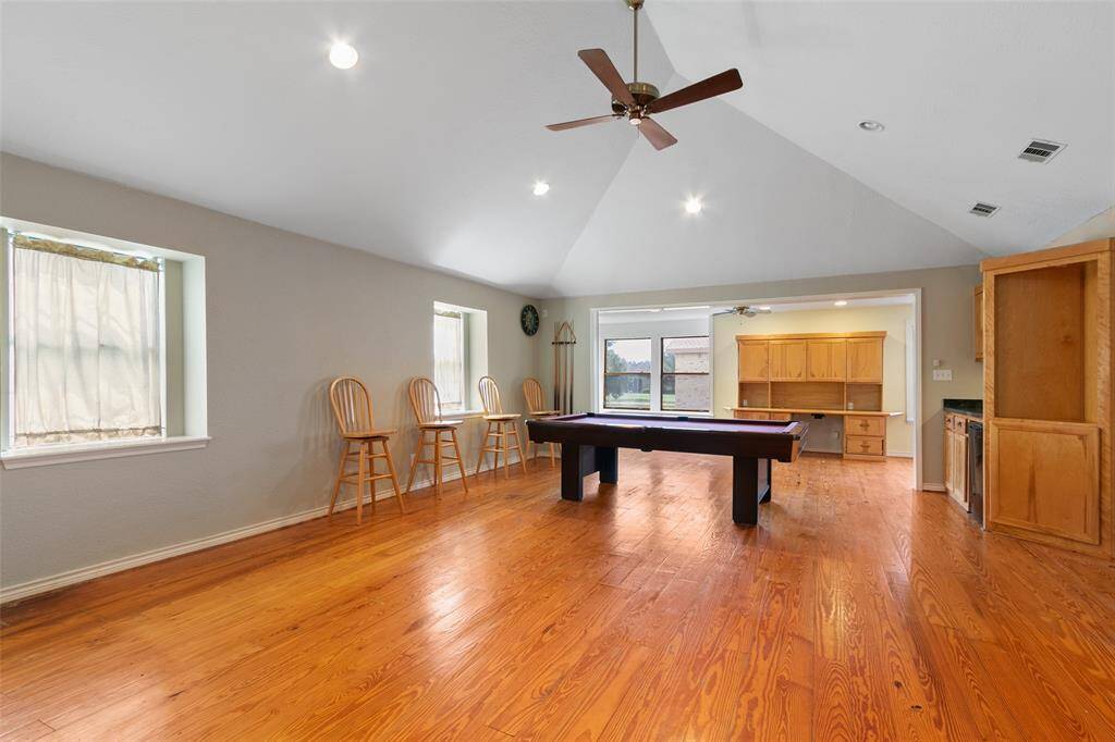 HUGE GAMEROOM HAS ROOM FOR GAME EQUIPMENT AND POOL TABLE