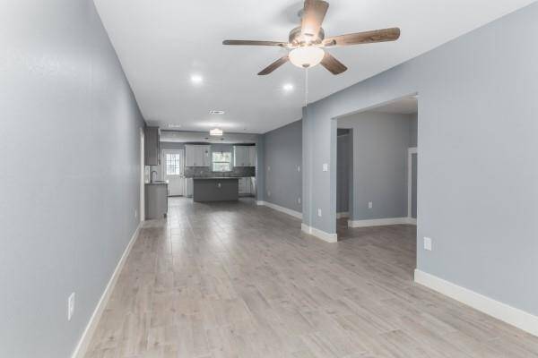 Master bedroom features bay windows perfect for a seating area.