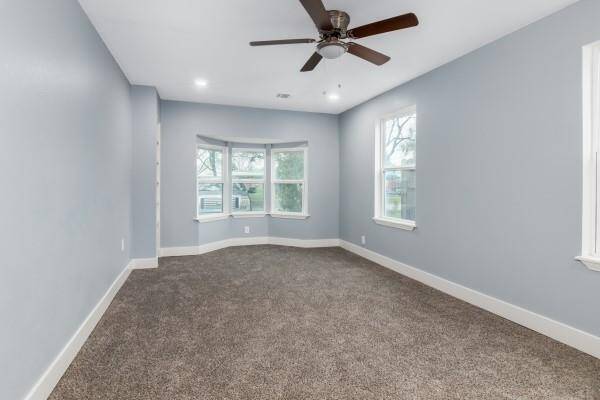 Master bathroom features recess lighting, double vanity, granite countertop and a walk-in shower with porcelain tile.