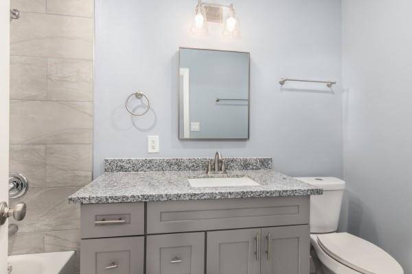 hallway bathroom features recess lighting, able space vanity with granite countertop, and soft close cabinet doors and drawers.