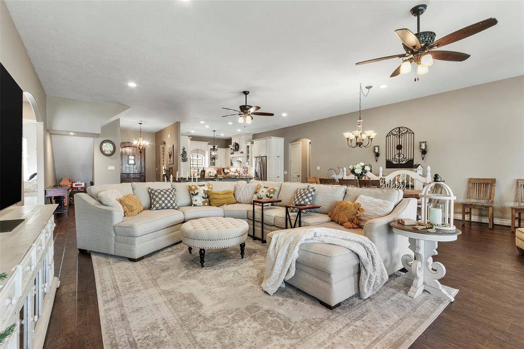 A view looking toward the kitchen and dining areas.  Inviting atmosphere perfect for family gatherings and entertaining.
