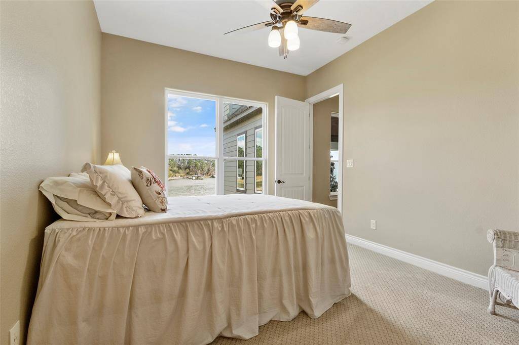 This secondary bedroom offers a gorgeous lake view!