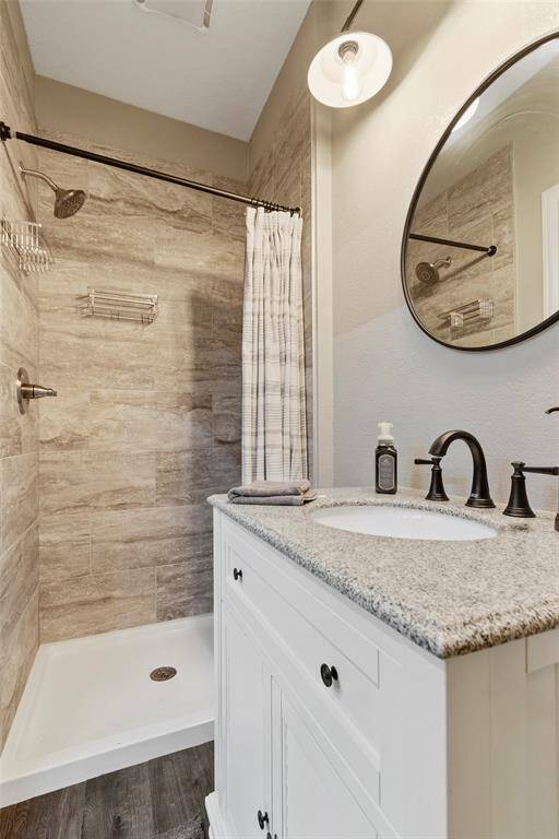 Convenient garage bath with a shower. Great for before or after you get out of the pool or working in the yard.