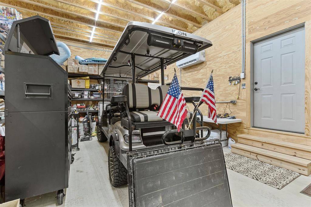 This spacious air conditioned garage can also double as a party room. Plenty of room for entertaining your guests.