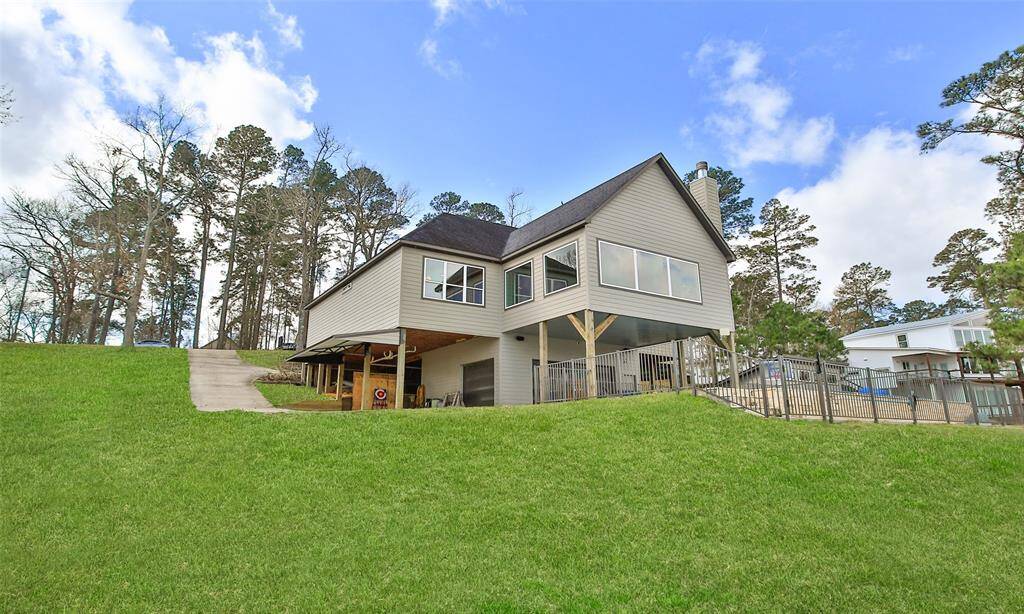 This waterfront property features a modern house with large windows and plenty of space for you and your family and  It includes a private dock, perfect for enjoying the scenic views and outdoor activities.