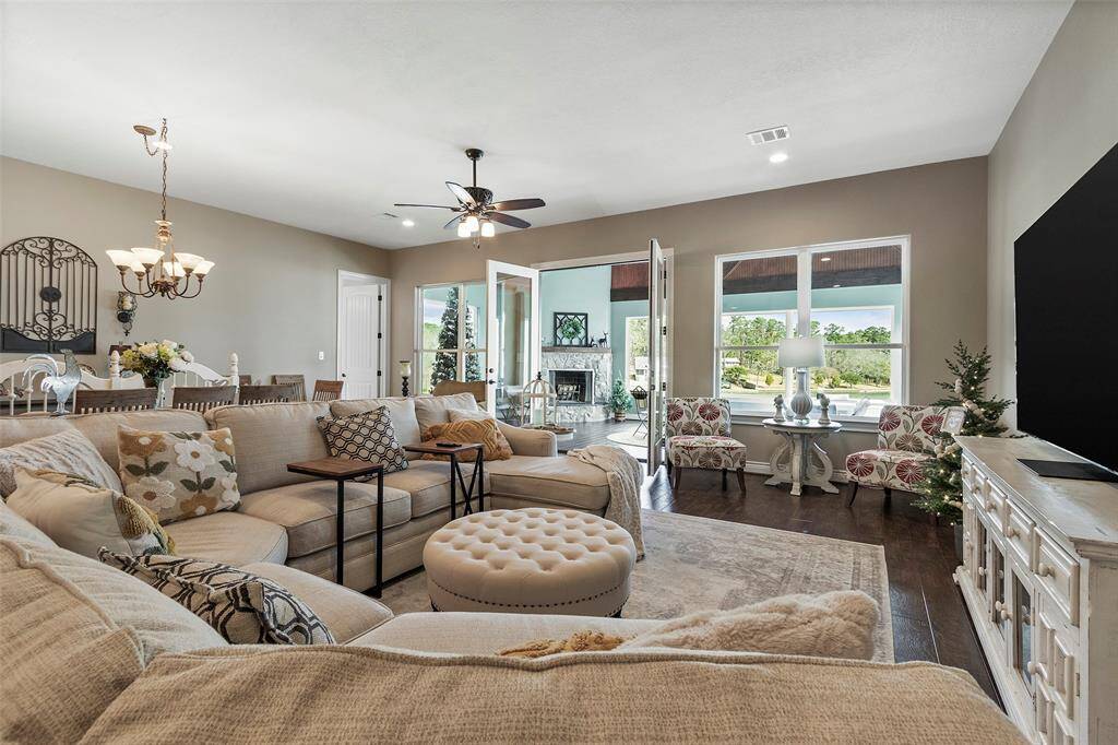 Spacious family room creates an inviting atmosphere for entertaining and relaxation. Beautiful luxury vinyl floors throughout!