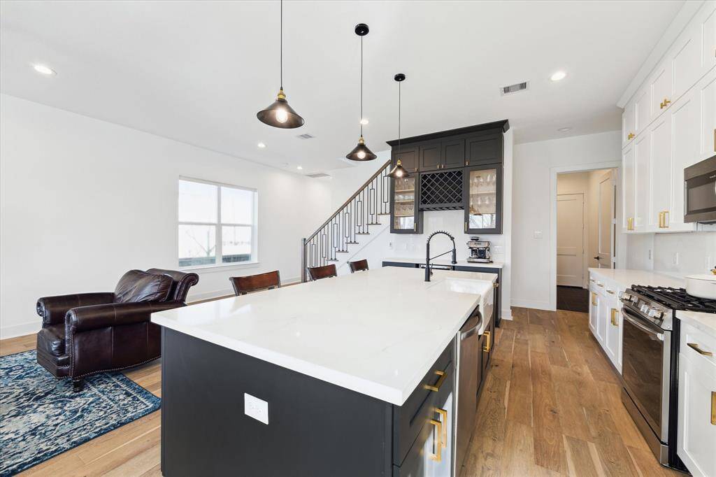 In the rear right of this picture is access to the incredible pantry (it's a must-see), mud room and garage.