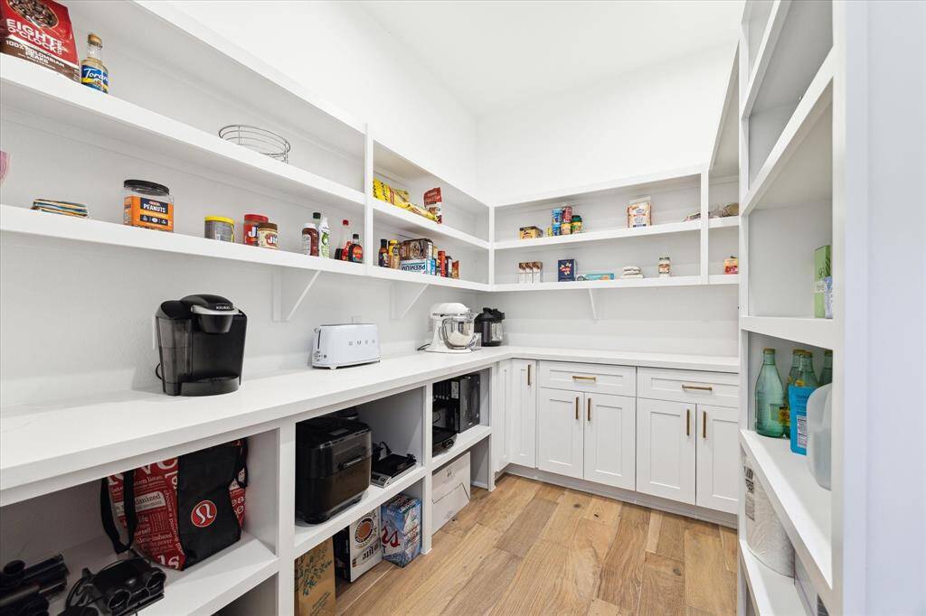 The pantry! Yes, the pantry. Plenty of room for your smaller appliances (if you don't want a cluttered look), and stocking up for the next hurricane. In addition to every day use.