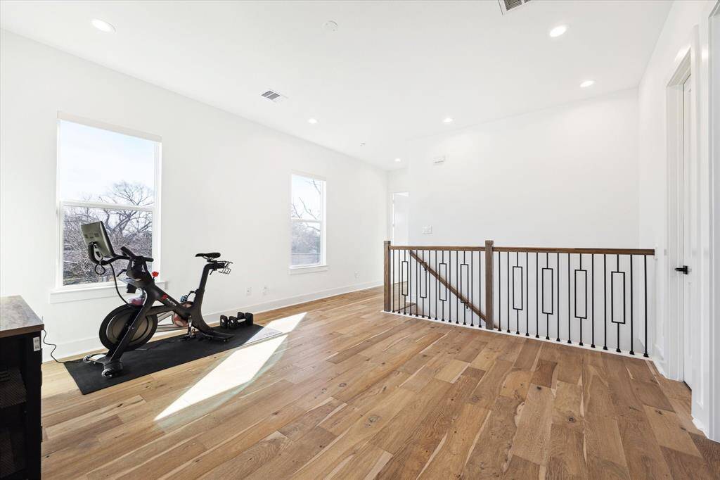 Upstairs is a central flex area - perfect as a gym, TV area, home office, play room ... you decide!