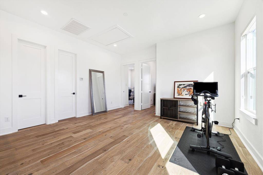 Another view of the upstairs flex room with access to the secondary full bath and a separate closet perfect for storage of exercise equipment, games, books ... it's up to you!