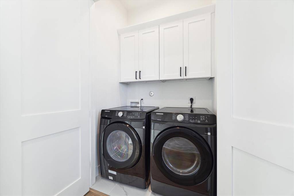 Dedicated utility closet with near-new washer and dryer that remain with the property.
