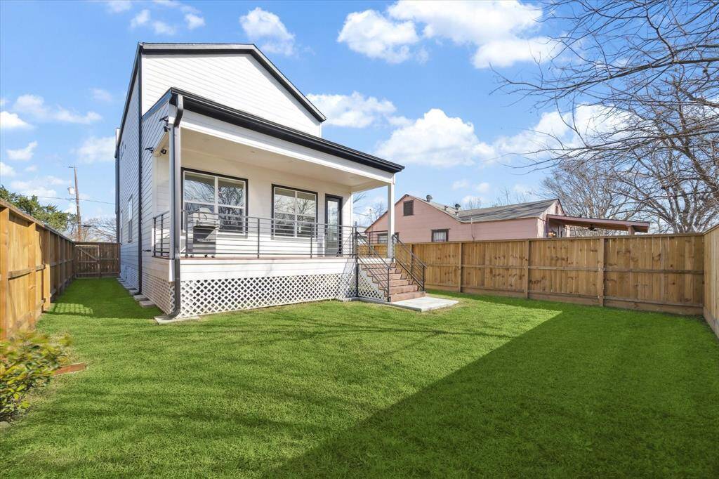 View of back yard and rear of house.