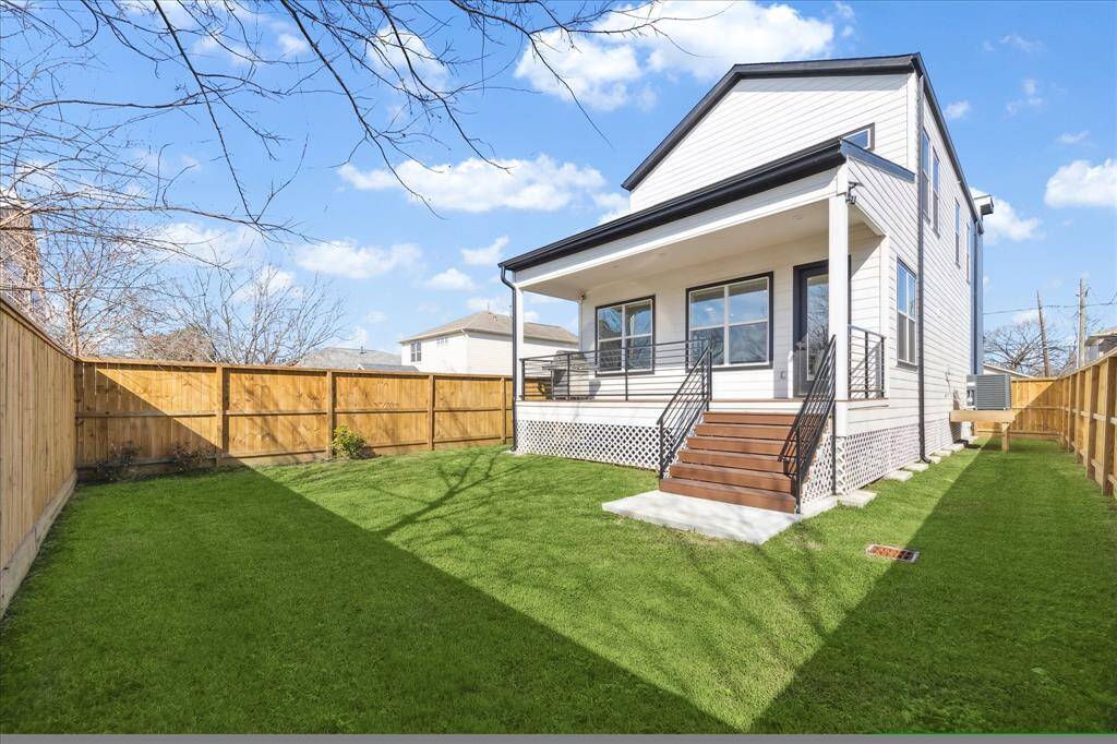 Another view of back yard and rear of house.