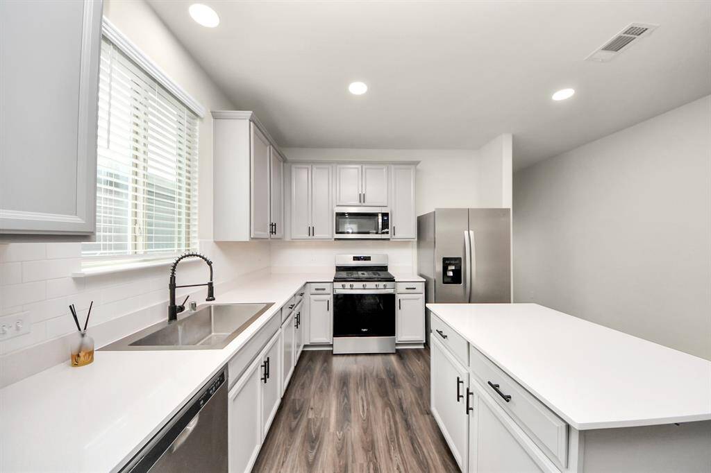Kitchen - Premium Stainless Steel Farmhouse sink. Recessed light additions. Under-counter lighting additions