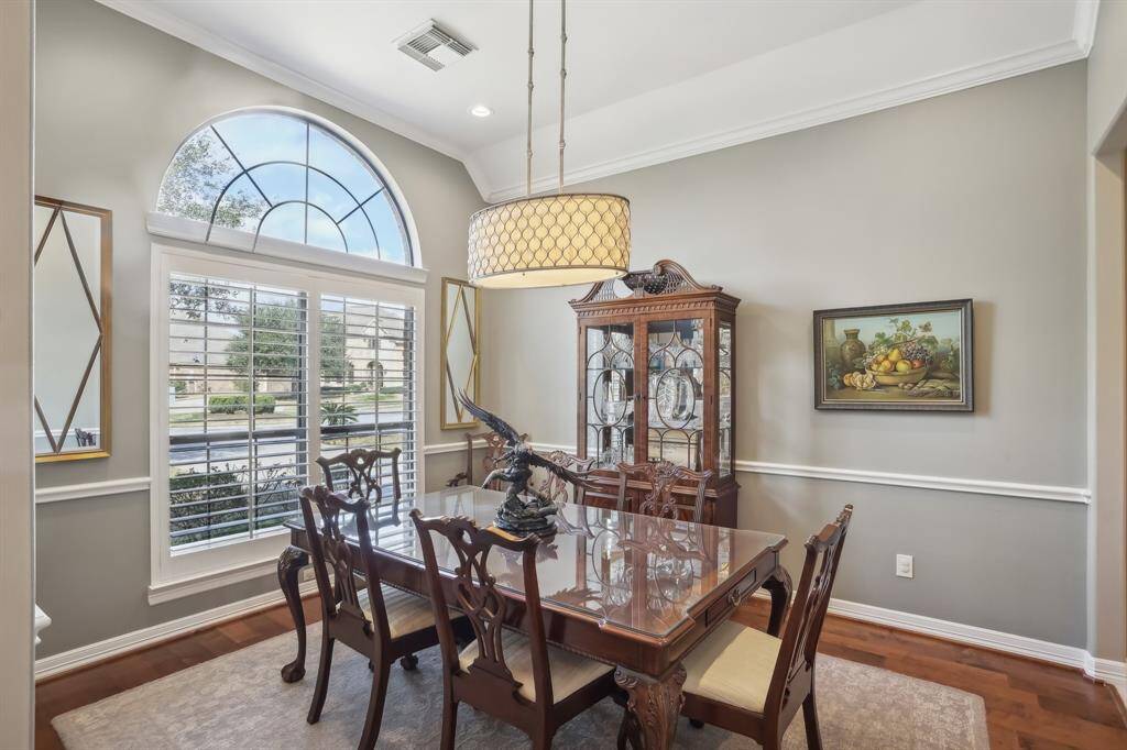 Formal dining room with high ceilings, Plantation shutters, and plenty of wall space for furnishings!