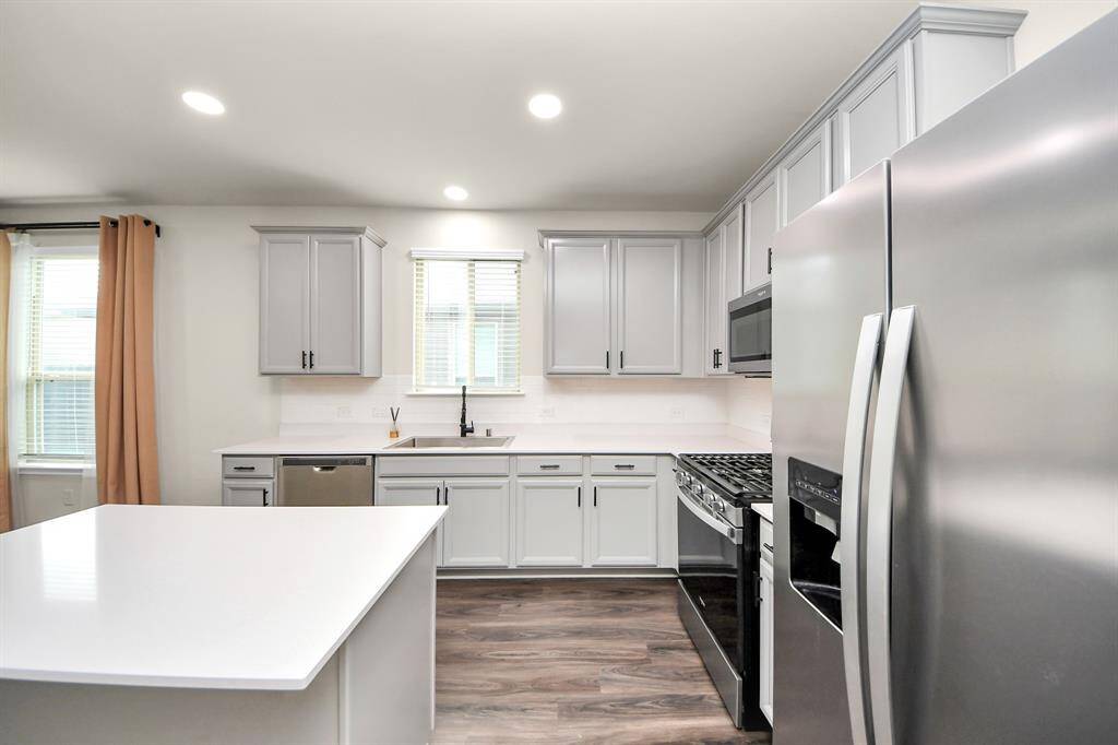 Kitchen - Premium Stainless Steel Farmhouse sink. Recessed light additions. Under-counter lighting additions