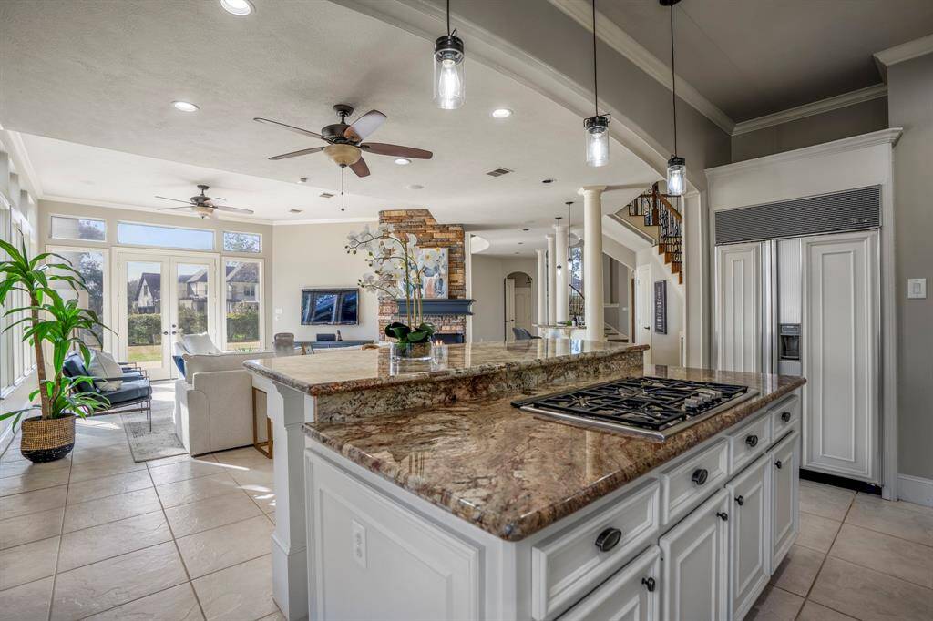 Enjoy looking out onto the beautiful yard from the kitchen and family room area, double doors lead out onto the outdoor patio.